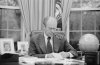 $1045_gerald_ford_working_at_his_desk_smoking_a_pipe.jpg