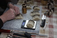 2. Weighing the exact amount of hair needed to make a knot.JPG