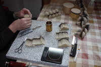 4. The forming box is tapped on the granite plate to get all the hairs aligned.JPG