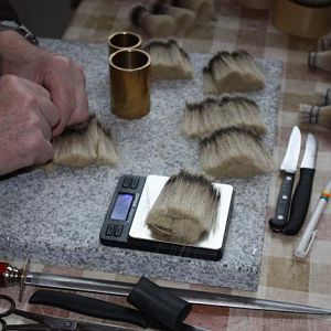 2. weighing the exact amount of hair needed to make a knot 1