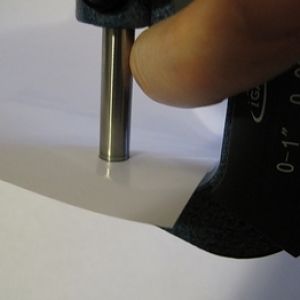 Cleaning Digital Micrometer Measuring Surfaces with Isopropyl Alcohol on Paper