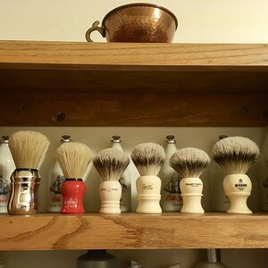 Brushes and some vintage bottles of Old Spice in the rear